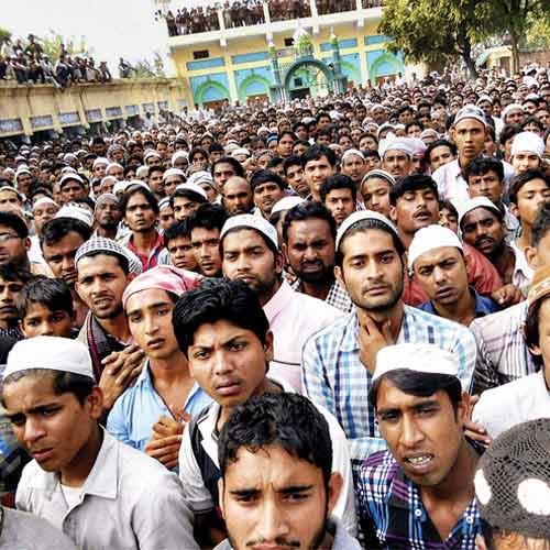 People take part in the burial procession of a violence victim at Hasanpur village Muzaffarnagar district on Thursday.