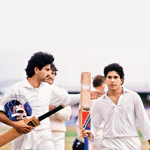 Manoj Prabhakar (L) pats Sachin Tendulkar after his unbeaten 119 ensured India drew the second Test against England at Old Trafford in August 1990.