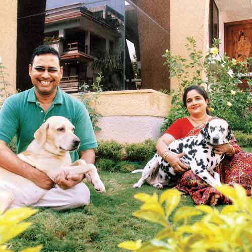 Asit Ghosh with his wife and two dogs