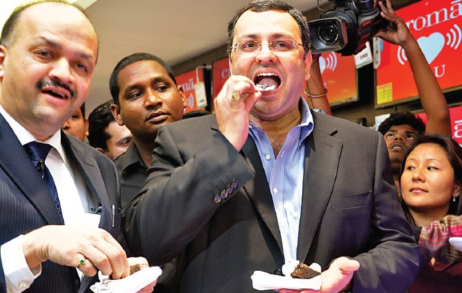 Tata Group Chairman Cyrus Mistry indulges his sweet tooth at the opening of the 101st store of the company’s electronic goods chain in Mumbai Tata Group Chairman Cyrus Mistry indulges his sweet tooth at the opening of the 101st store of the company’s electronic goods chain in Mumbai