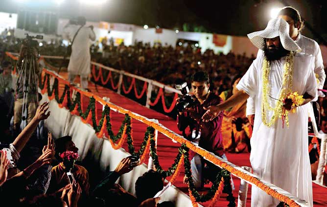 Art of Living founder and spiritual guru Sri Sri Ravi Shankar greets his followers at the Police Ground in Ghatkopar on Sunday —dna photo Art of Living founder and spiritual guru Sri Sri Ravi Shankar greets his followers at the Police Ground in Ghatkopar on Sunday —dna photo