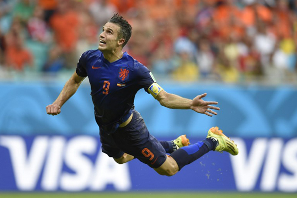 Netherlands' forward Robin van Persie scores during a Group B football match between Spain and the Netherlands at the Fonte Nova Arena in Salvador during the 2014 FIFA World Cup on June 13, 2014. Netherlands' forward Robin van Persie scores during a Group B football match between Spain and the Netherlands at the Fonte Nova Arena in Salvador during the 2014 FIFA World Cup on June 13, 2014.