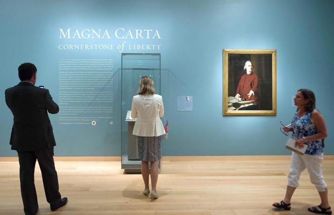 Visitors view one of four remaining copies of the original Magna Carta, a document written in 1215, on display at the Museum of Fine Arts in Boston June 30, 2014 . An inspiration for the U.S. Constitution and Bill of Rights, the document is on loan from England's Lincoln Cathedral. REUTERS/Gretchen Ertl Visitors view one of four remaining copies of the original Magna Carta, a document written in 1215, on display at the Museum of Fine Arts in Boston June 30, 2014 . An inspiration for the U.S. Constitution and Bill of Rights, the document is on loan from England's Lincoln Cathedral. REUTERS/Gretchen Ertl