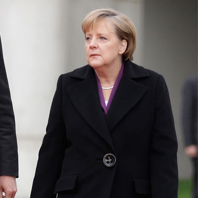 Angela Merkel says euro zone reforms must continue after ECB move.