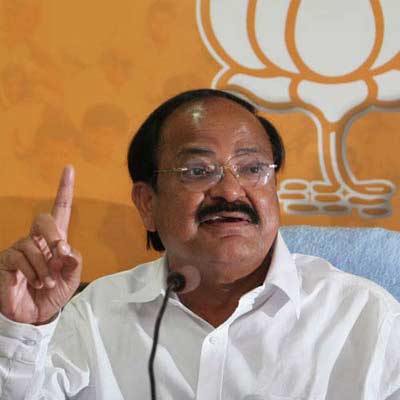 AAP discredited for joining hands with Congress, says Venkaiah.