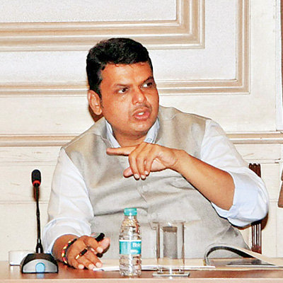 Maharashtra CM Fadnavis calls rail budget practical; opposition.