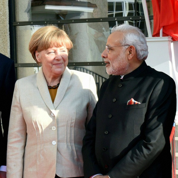 Prime Minister Narendra Modi anPTId German Chancellor Angela Merkel, at the opening of the industrial fair in Hanover, Germany, Sunday. PTI
