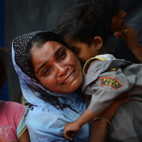 Stranded boat with Bangladeshi, Rohingya migrants finds nowhere to.
