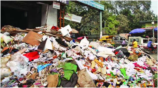 City stinks as sanitation workers remain on strike
