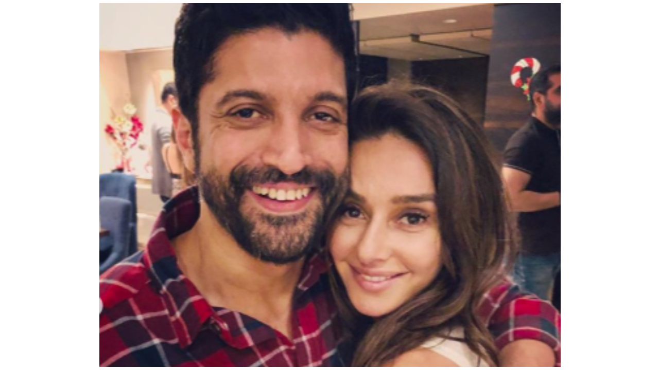 Farhan Akhtar is all smiles as he poses for a picture with rumoured girlfriend Shibani Dandekar