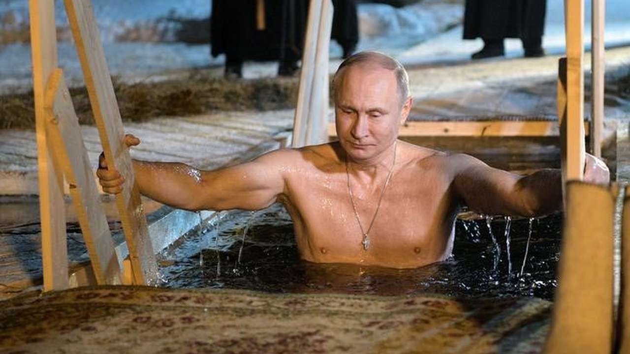 Putin celebrates Epiphany by bathing in ice cold waters Putin celebrates Epiphany by bathing in ice cold waters