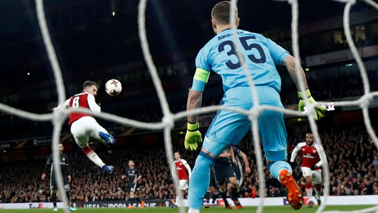 Arsenal's Aaron Ramsey scores their third goal on Friday