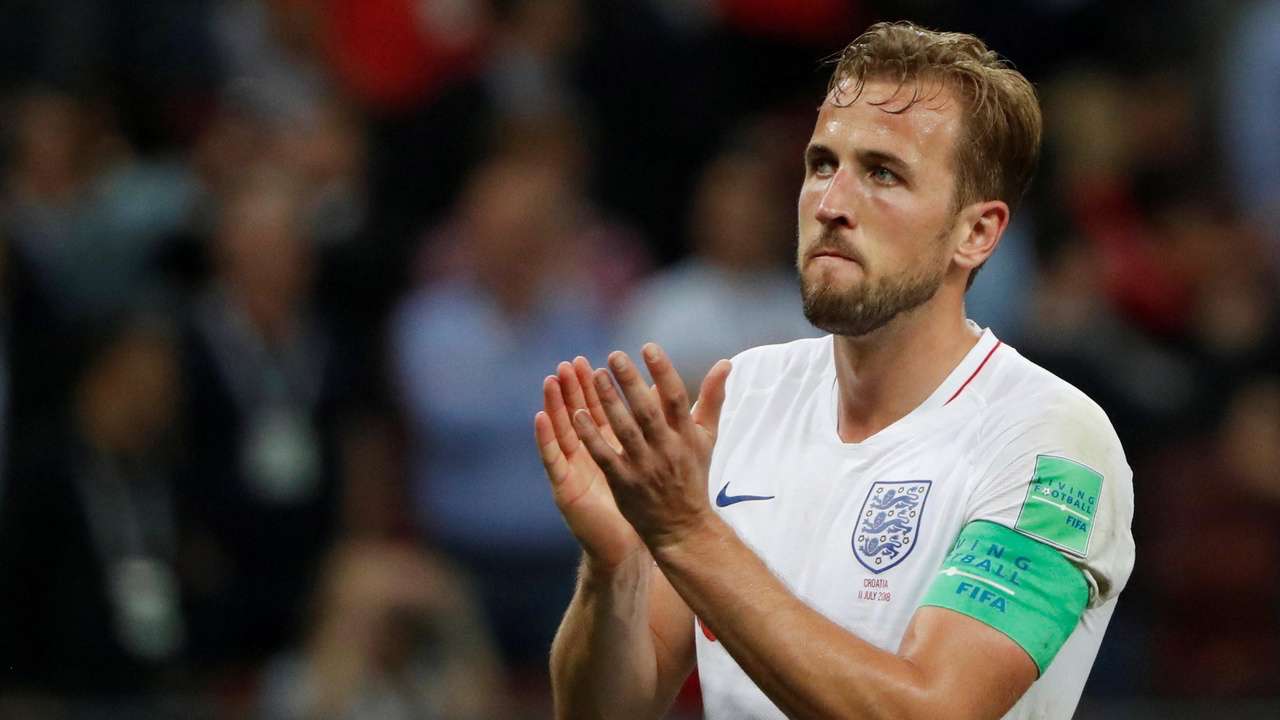 Image result for kane holding the 2018 world cup golden boot