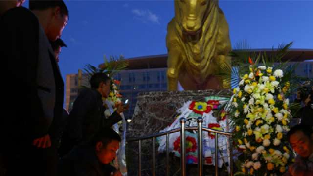 People light candles in front of wreaths outside Kunming railway station after a knife attack, Yunnan province People light candles in front of wreaths outside Kunming railway station after a knife attack, Yunnan province