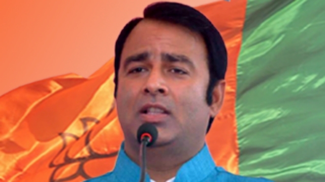 BJP MLA kin held with pistol in polling booth BJP MLA kin held with pistol in polling booth