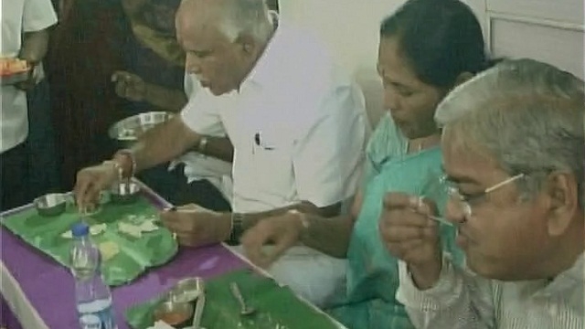 Yeddyurappa under fire for eating 'hotel food' at Dalit's house
