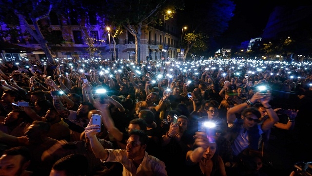 People expressing joy with their flash lights on 