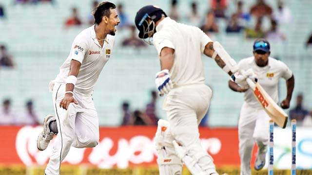 Pujara holds out as India struggle against SL in rain-hit Test