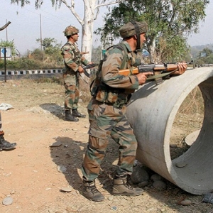 Security personnel take positions during a gun battle with suspected militants at Army camp at Nagrota near Jammu on Tuesday Indian Army Nagrota terrorist attack PTI