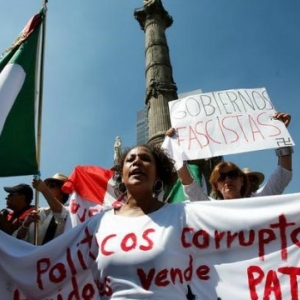 Demonstrators display messages against corruption and fascism during a protest against U.S. President Donald Trumps proposed border wall, and to call for unity, in Mexico City, Mexico, February 12, 2017 Demonstrators display messages against corruption and fascism during a protest against U.S. President Donald Trumps proposed bor