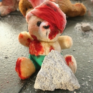 The man beheaded a red teddy bear with a sharp knife in a mosque in Mosul, northern Iraq, The man beheaded a red teddy bear with a sharp knife in a mosque in Mosul, northern Iraq,